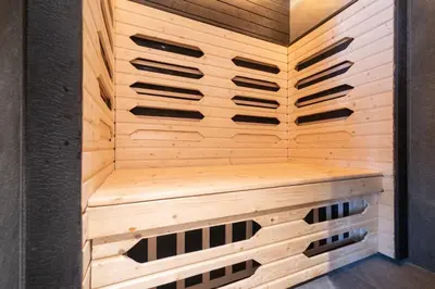 a sauna with a wooden paneled wall at The Title Legendary D-605 1 BR Bangtao Beach in Bang Tao Beach
