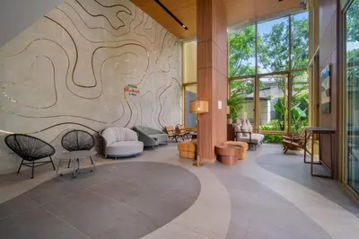 a lobby with a mural on the wall at Beachside by Villacarte in Bang Tao Beach
