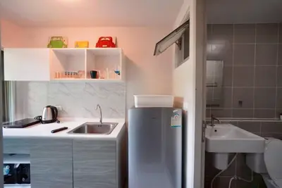 a small kitchen with a sink and a refrigerator at Valley Mountain ViewCity Proximity Golden Eight Apartment in Phuket Town