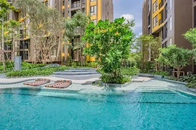 a swimming pool in a city with buildings at 1 Bedroom close to Central Shopping Mall in Ban Rangeng