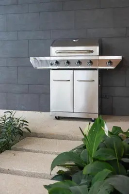 a stainless steel barbecue grill sitting on a patio at Botanica Four Seasons Bang Tao by My Home Phuket in Ban Na Sok