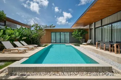 a swimming pool in the backyard of a house at Botanica Four Seasons Bang Tao by My Home Phuket in Ban Na Sok