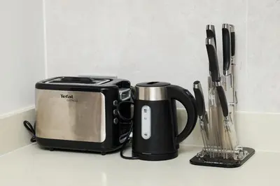 a kitchen counter with a coffee maker and a toaster at Laguna BeachSide Bang Tao by My Home Phuket in Bang Tao Beach