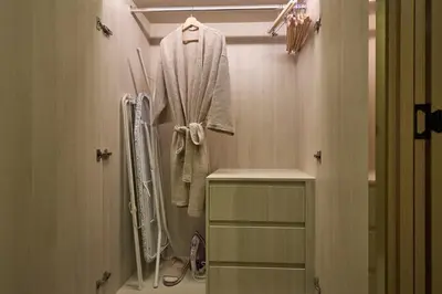 a bathroom with a shower and a robe on a rack at Ozone condominium Bang Tao by My Home Phuket in Laguna Phuket