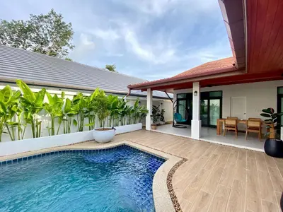 a swimming pool in front of a house at Baanthai villa Rawai in Rawai Beach