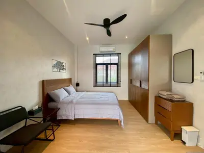 a bedroom with a bed and a ceiling fan at Baanthai villa Rawai in Rawai Beach