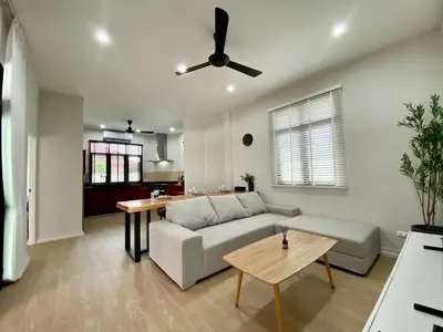 a living room with a couch and a table at Baanthai villa Rawai in Rawai Beach