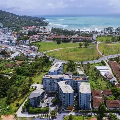 an aerial view of a city with buildings and the ocean at C255 Best Stay Experience Condo with Full Facilities in Kamala Beach