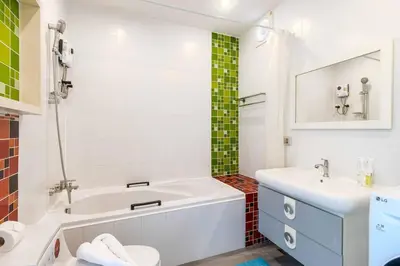 a bathroom with a tub and a toilet and a sink at V274 Prime Location Large Terrace Pool View BBQ in Ban Saiyuan (1)