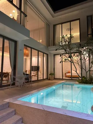 a swimming pool in the middle of a house at Pride luxury house in Koh Lone