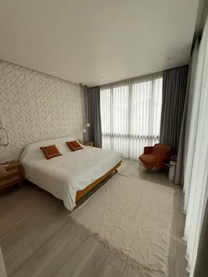 a bedroom with a bed and a large window at Pride luxury house in Koh Lone