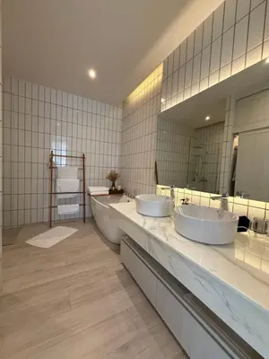a bathroom with two sinks and a large mirror at Pride luxury house in Koh Lone