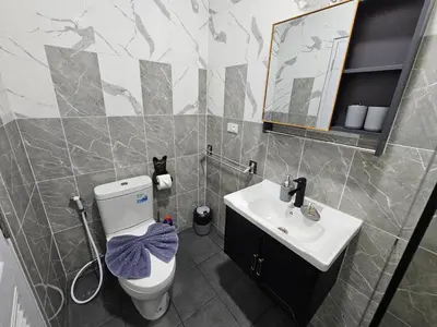 a bathroom with a toilet and a sink at 2 Bedrooms Tropical Pool Villa Rawai in Rawai Beach
