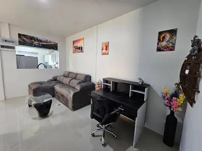 a living room with a couch and a desk at 2 Bedrooms Tropical Pool Villa Rawai in Rawai Beach