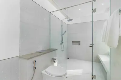 a bathroom with a toilet and a glass shower at V275 Stay with Nature 2BR Peaceful Pool Villa in Ban Pak Lak