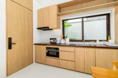 a kitchen with a sink and a window at V275 Stay with Nature 2BR Peaceful Pool Villa in Ban Pak Lak