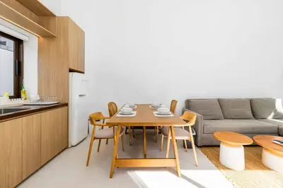 a kitchen and dining room with a table and a couch at V275 Stay with Nature 2BR Peaceful Pool Villa in Ban Pak Lak