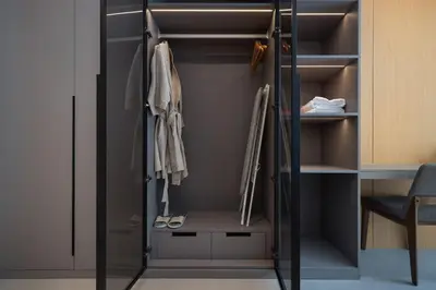 a walk in closet with a glass door at Sunshine Beach Bang Tao by My Home Phuket in Layan Beach