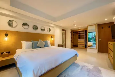 a large bedroom with a large bed and a kitchen at RIVERHOUSE Solar-Powered Luxury Pool Villas in Laguna Phuket