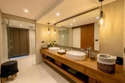 a bathroom with two sinks and a large mirror at RIVERHOUSE Solar-Powered Luxury Pool Villas in Laguna Phuket