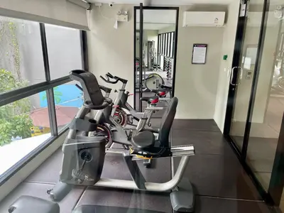 a gym with a cardio machine in a building at Diamond Resort 1 Bdr Bang Tao in Bang Tao Beach