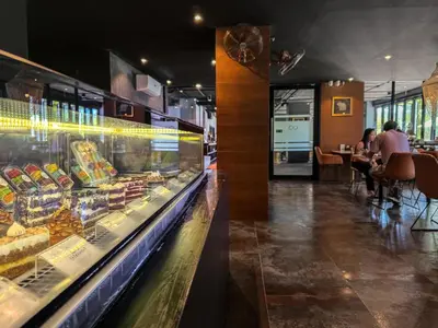 a bakery with a display case filled with food at Comfortable 1 bdr Kamala City Gate in Kamala Beach