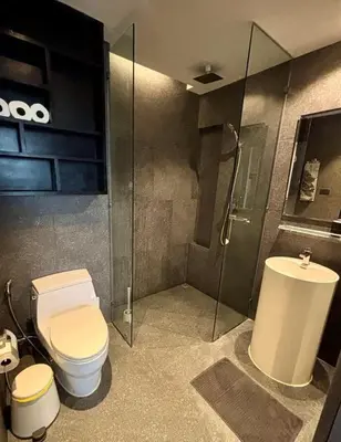 a bathroom with a toilet and a shower and a sink at Comfortable 1 bdr Kamala City Gate in Kamala Beach