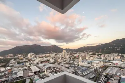 a view of a city with buildings and mountains at Highest Apartment in Phuket Panaromic Seaview in Patong Beach