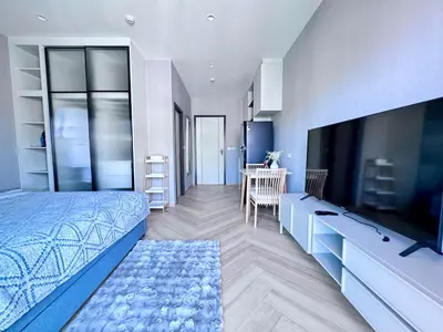 a bedroom with a bed and a flat screen tv at Title Legendary 7 floor Mountain View in Bang Tao Beach