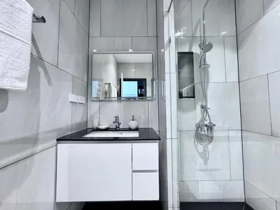 a white bathroom with a sink and a shower at Title Legendary 7 floor Mountain View in Bang Tao Beach