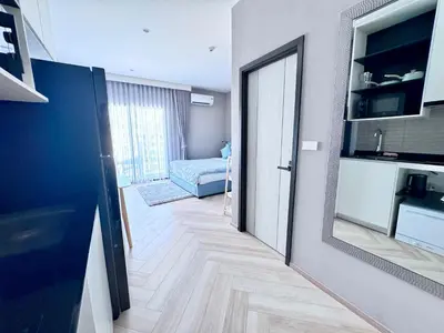 a room with a hallway with a door and a bedroom at Title Legendary 7 floor Mountain View in Bang Tao Beach