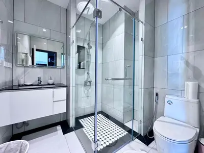 a bathroom with a shower and a toilet and a sink at Title Ledgendary 7th Floor in Bang Tao Beach