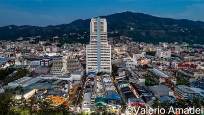 a city with a tall building in the middle at OMNIAPhuket - Sea View Patong Tower 100m to Beach in Patong Beach