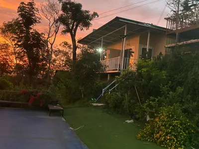 a house with a lawn in front of it at Mong Do Lay Baan Sea View in Ban Ao Makham