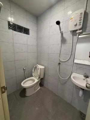 a bathroom with a shower and a toilet and a sink at Mong Do Lay Baan Sea View in Ban Ao Makham