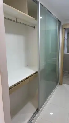 a walk in closet with a glass door at 3 Beds patong baycleef residence in Patong Beach