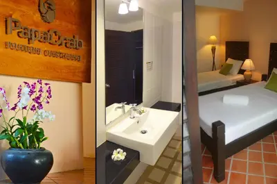 two pictures of a bathroom with a sink and a bedroom at PapaCrab Boutique Guesthouse in Kamala Beach