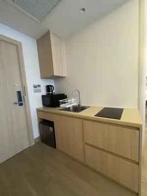 a kitchen with a sink and a counter top at Apartment Wyndham Naithon in Nai Thon Beach
