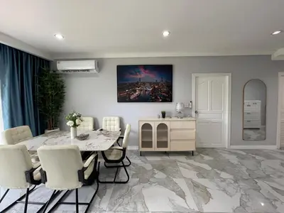 a dining room with a table and chairs at Green place condominium in Ban Lo Long