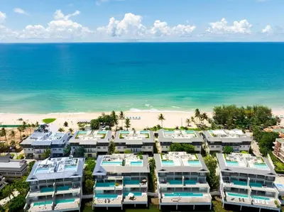 an aerial view of a resort with the beach at Beachfront residence - just a step from the beach in Laguna Phuket