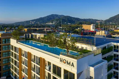 a view of a building with a swimming pool at HOMA Chalong Bay in Ban Klang