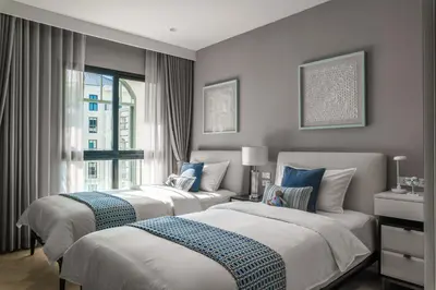 a bedroom with two beds and a window at The Title Legendary White Reef 2BR in Bang Tao Beach