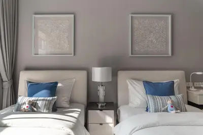 two beds in a bedroom with blue and white at The Title Legendary White Reef 2BR in Bang Tao Beach