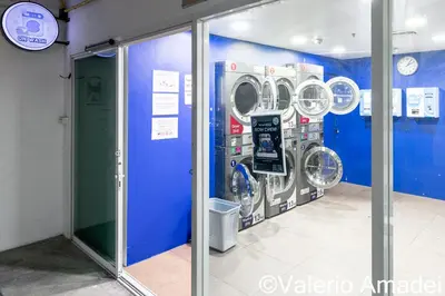 a washer and dryer in a room at OMNIAPhuket - 2 Bedrooms Flat - Pool View - Gym in Patong Beach