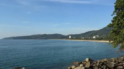 a view of a beach with mountains in the background at Holiday home in Ban Na Khua