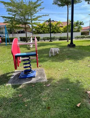 a dog is standing next to a toy playground at Holiday home in Ban Na Khua