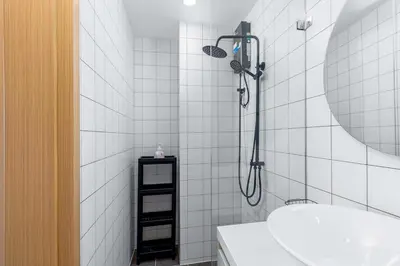 a bathroom with a shower and a sink at C256 2BR Stay Close to Beach Rooftop Pool Views in Kamala Beach