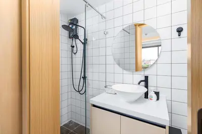 a bathroom with a sink and a shower at C256 2BR Stay Close to Beach Rooftop Pool Views in Kamala Beach