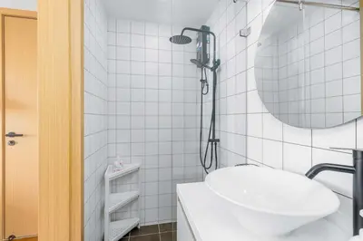 a white bathroom with a sink and a mirror at C256 2BR Stay Close to Beach Rooftop Pool Views in Kamala Beach