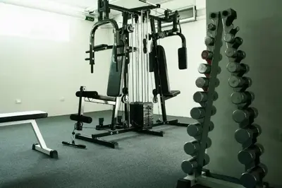 a room with a gym with several tread machines at Beachfront Patong Hillside Modern Apartment in Patong Beach